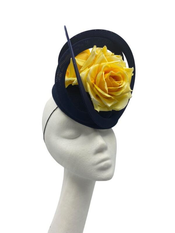Stunning french navy velvet headpiece with matching navy swirl detail and finished with the most beautiful yellow flowers detail.